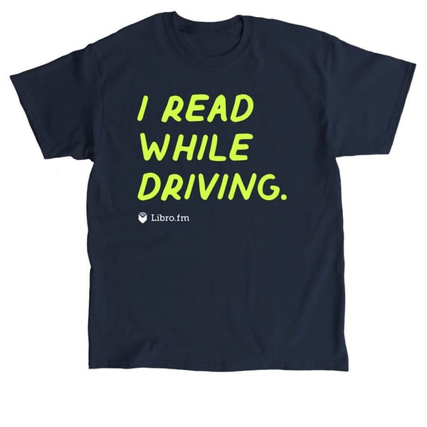A blue shirt that reads I Read While Driving with the libro.fm logo